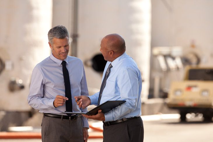 Businessmen discussing company plans 